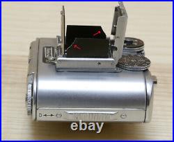 Concava Tessina Microcamera svizzera reflex 35mm TLR motorizzata a molla