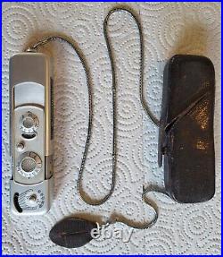 Vintage Minox B Miniature Spy Camera with Flash gun, owner manual, and book