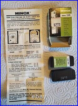 Vintage Minox B Miniature Spy Camera with Flash gun, owner manual, and book